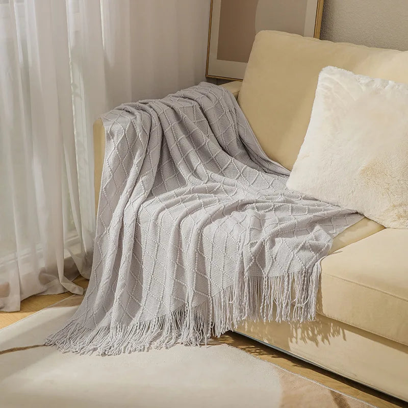 Jeté décoratif en maille texturée avec franges